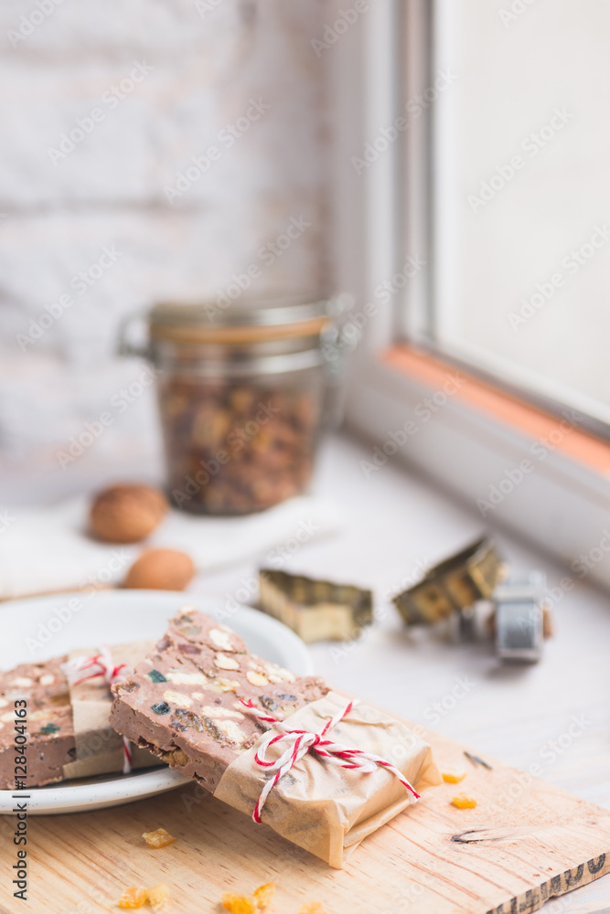 Festive chocolate block tied with string. Shallow depth of field.