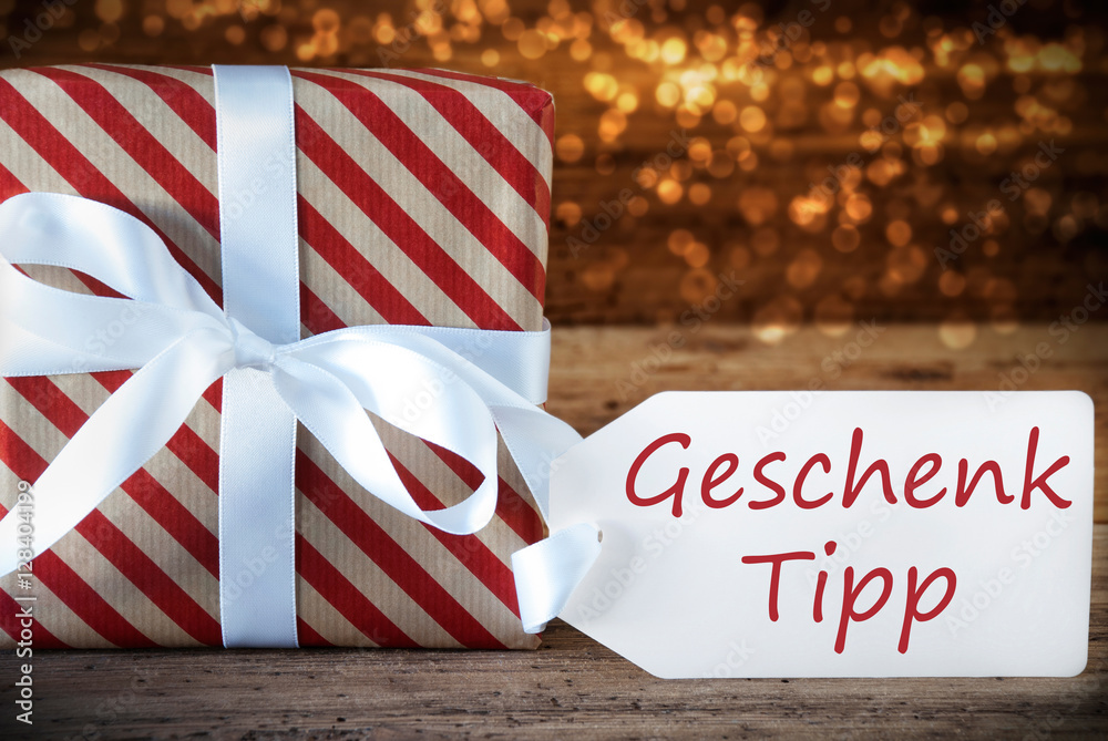Fototapeta premium Atmospheric Christmas Present With Label, Geschenk Tipp Means Gift Tip