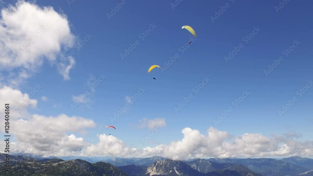 paragliding over the rocky Alps mountains landscape paragliding over the rocky Alps mountains landscape