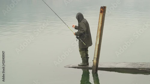 Fisherman prepares the fishline photo