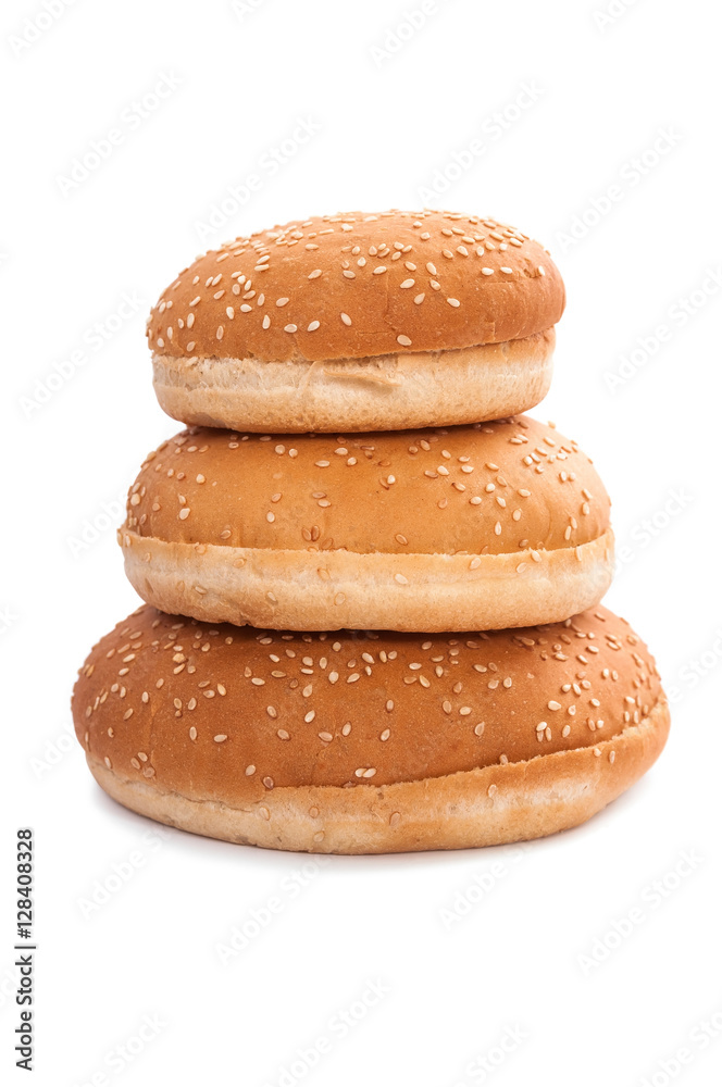 Stack of burger buns with sesame seeds on white background Stack of burger buns with sesame seeds on white background