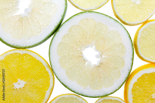 Slices citrus fruits on whi...