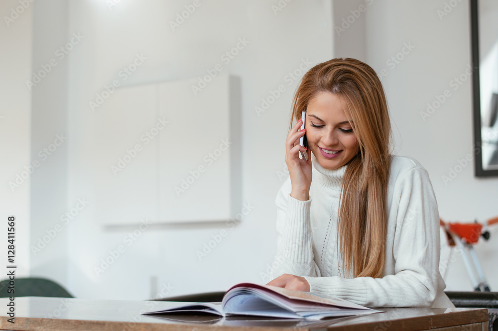 Carefree talk with friend. Cheerful young woman talking on phone Carefree talk with friend. Cheerful young woman talking on phone