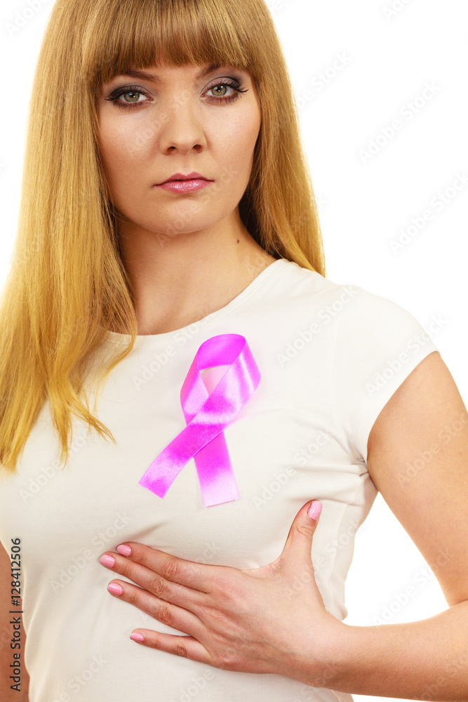 Woman sad girl wih pink cancer ribbon on chest Woman sad girl wih pink cancer ribbon on chest