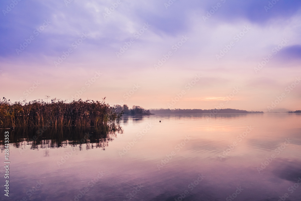 Fototapeta premium Sunrise on the quiet lake and reeds
