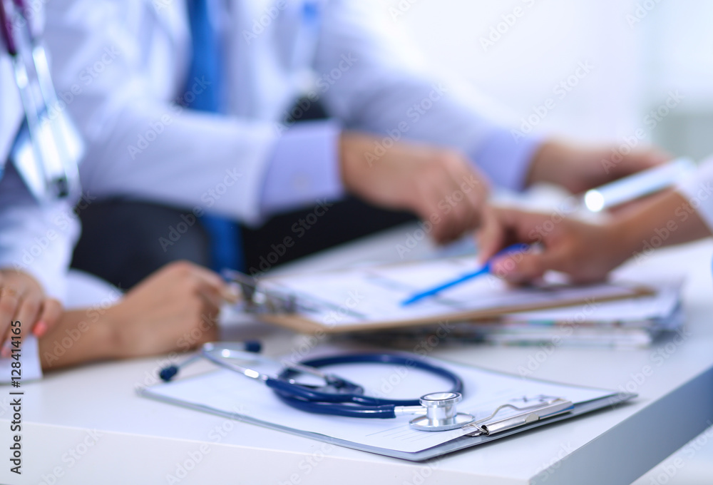 Happy medical team discussing and working together Happy medical team discussing and working together