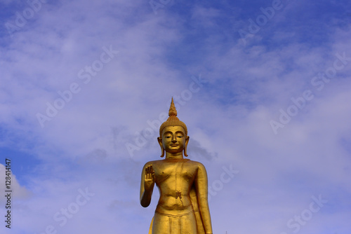 Buddha statue on blue sky