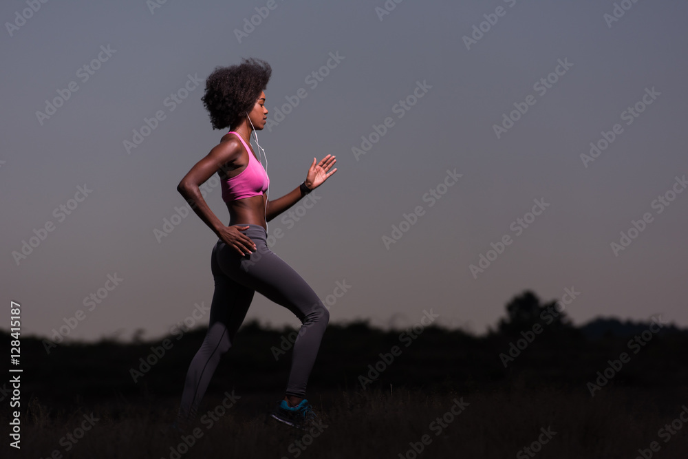 Young African american woman jogging in nature Young African american woman jogging in nature