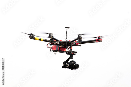 drone with professional camera flying.
