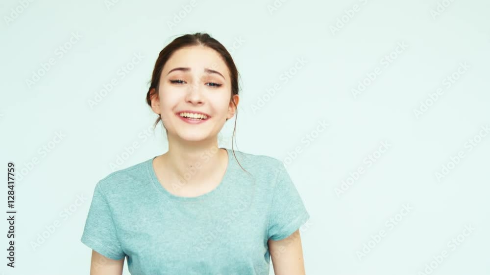 Portrait cheerful teenage girl 14 years teenager laughing at camera on white background. Teen looking at camera Portrait cheerful teenage girl 14 years teenager laughing at camera on white background. Teen looking at camera