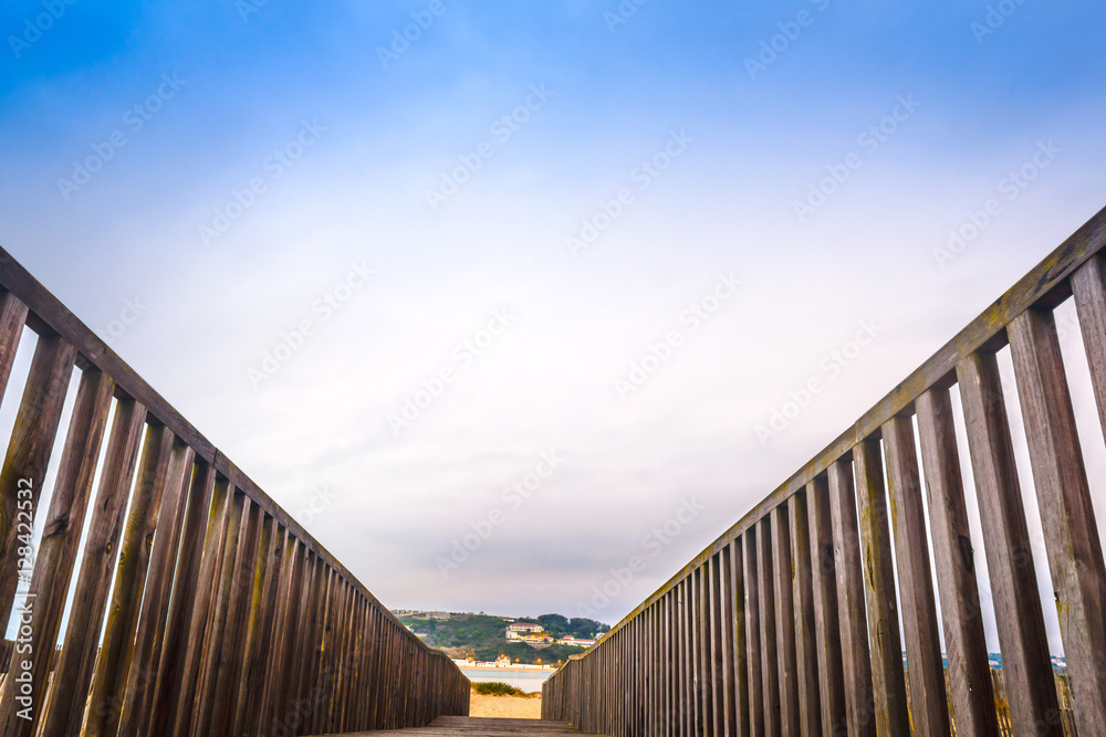 Naklejka premium Wooden walking path at the beach. Obidos Lagoon. Portugal