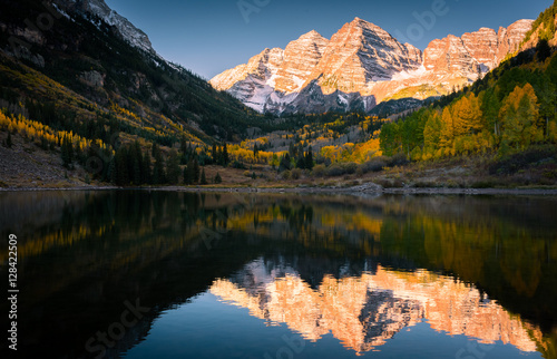 Maroon Bells reflected in Maroon Lake at sunrise