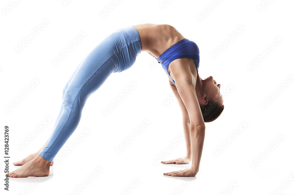 Practice yoga and gymnastics. Young girl on a white background.