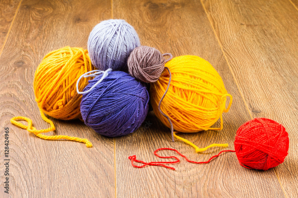 yellow, dark blue, lilac, brown and red yarn