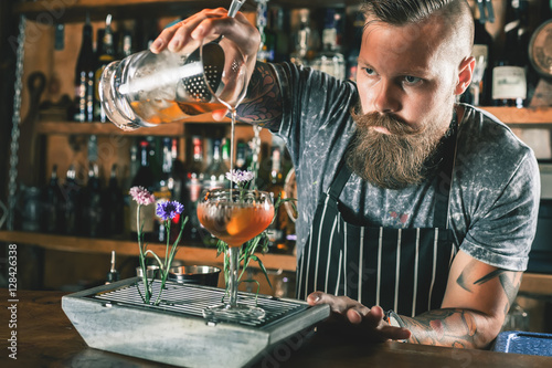 Barman is making cocktail photo
