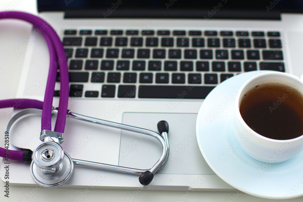 Doctor office,Top view ,Laptop with cup of coffee Doctor office,Top view ,Laptop with cup of coffee