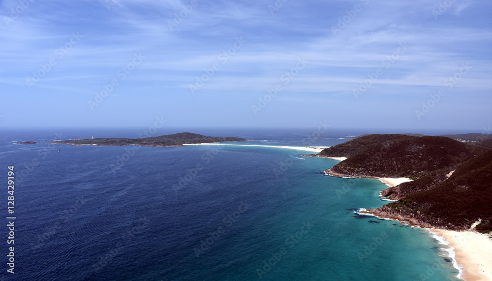 Shark Island and coastline of Shoal bay on a sunny day from Mount Tomaree Lookout (Central Coast, NSW, Australia) Shark Island and coastline of Shoal bay on a sunny day from Mount Tomaree Lookout (Central Coast, NSW, Australia)