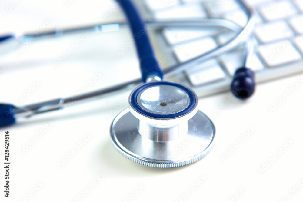 medical stethoscope near laptop on wooden table, white medical stethoscope near laptop on wooden table, white