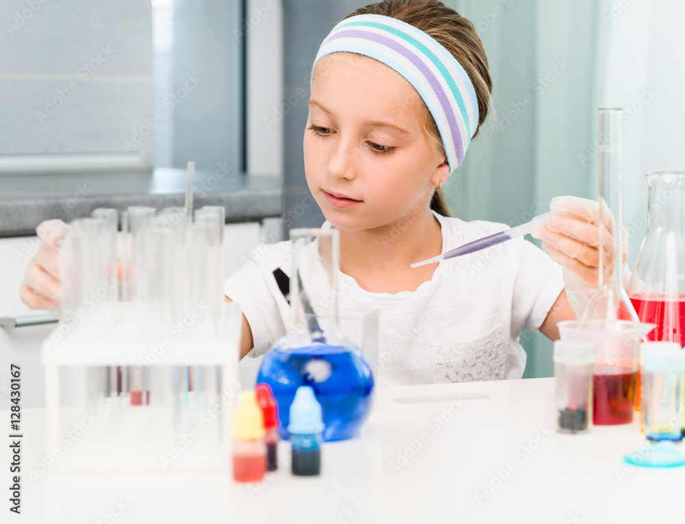 little girl with flasks for chemistry little girl with flasks for chemistry