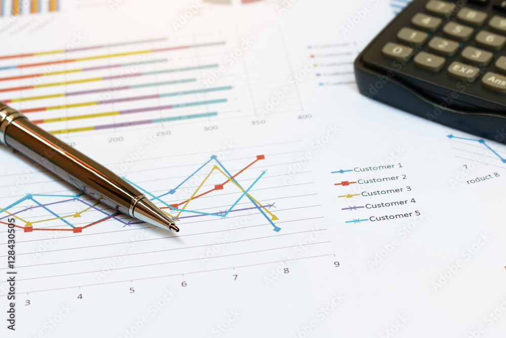 Close up business concept, Pen is on summary report and calculat Close up business concept, Pen is on summary report and calculat