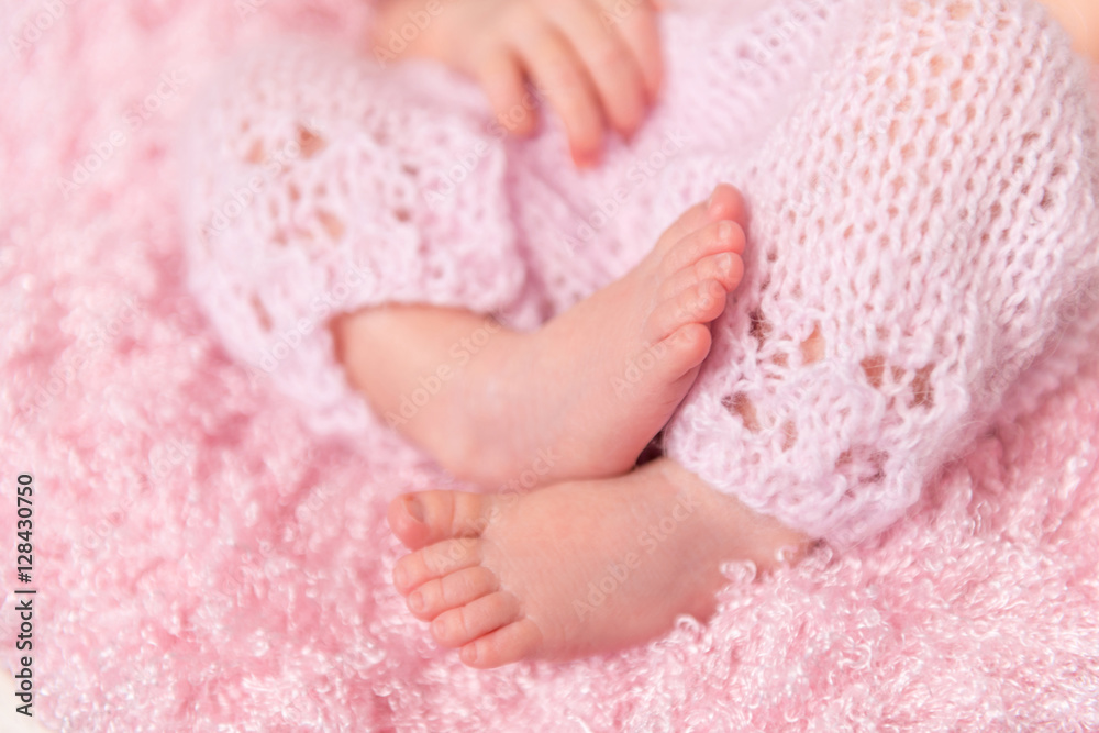 beautiful folded legs of a newborn baby