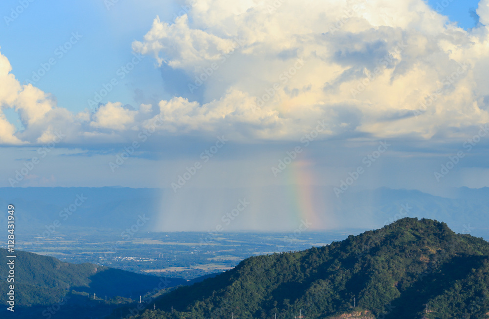 cloud with rain and rainbow over mountain at Khao Kho, Thailand