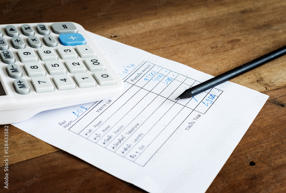 Utility bill with calculator and pencil, Save money concept Utility bill with calculator and pencil, Save money concept