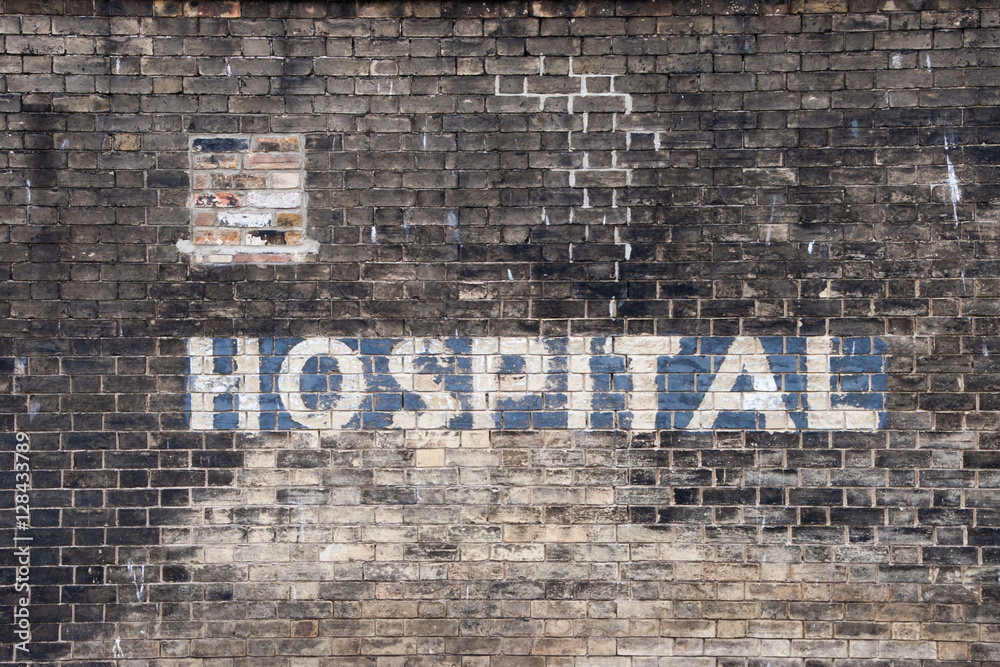 Fototapeta premium Old Painted Hospital Sign