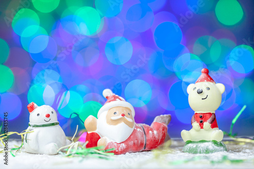 Santa claus and snowman with bokeh background
