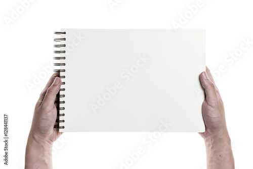 Two hands hold a empty(blank) book spread isolated white.