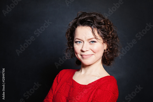 Smiling Mature Woman on Blackboard Background. Mature Beauty
