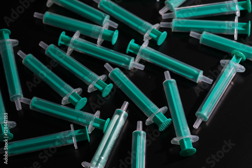 Medical syringes on a black background
