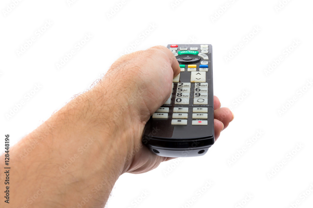 Hand holding TV remote control, isolated on white background Hand holding TV remote control, isolated on white background