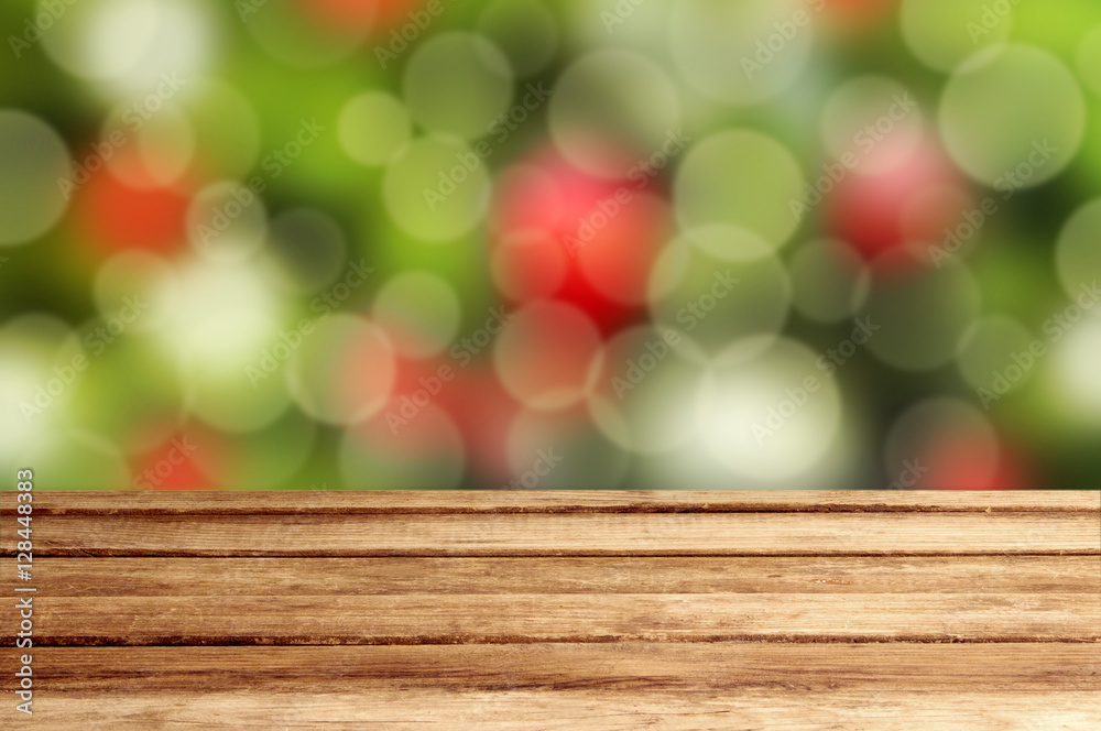 Christmas holiday background with empty wooden table over festiv