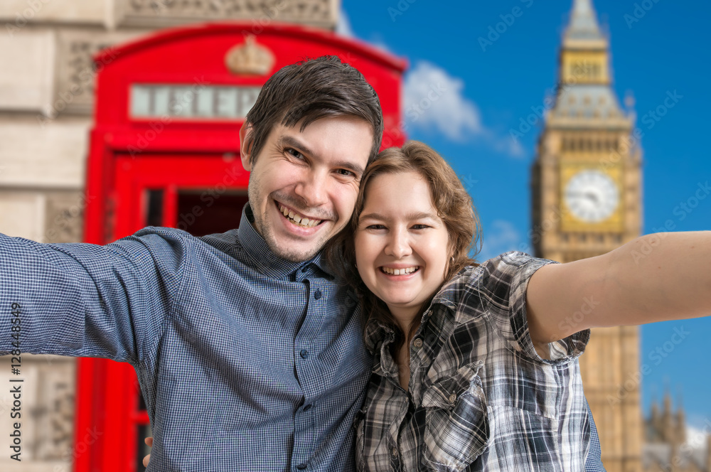 Selfie photo of young happy couple travelling in London.