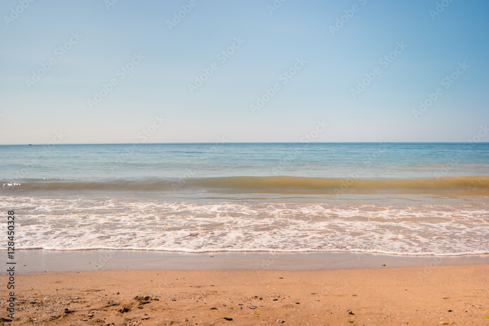 Sand with sea. Water, cloudless sky and horizon. Perfect spot for summer rest. Little piece of paradise.