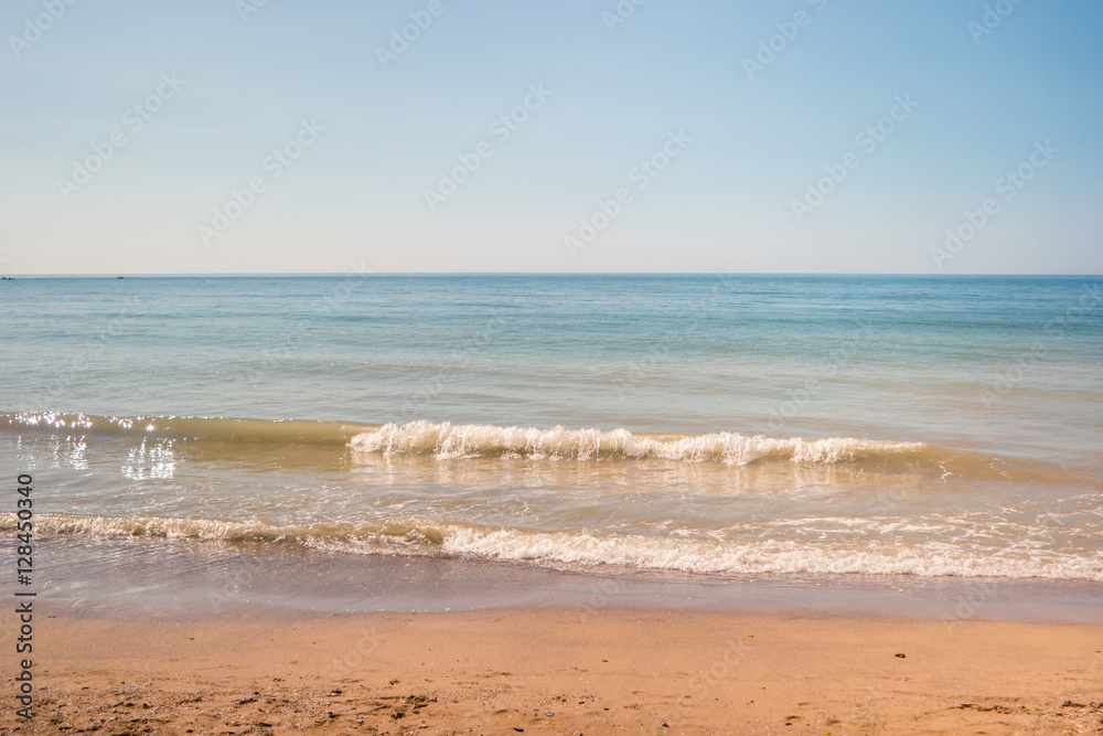 Sea with sand. Water, waves and horizon. Beautiful spot for summer rest. Paradise on earth.