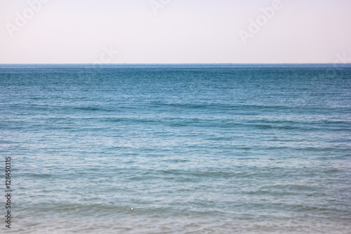 Sea and cloudless sky. Blue water and horizon. Infinity is waiting. Seascape at daytime.