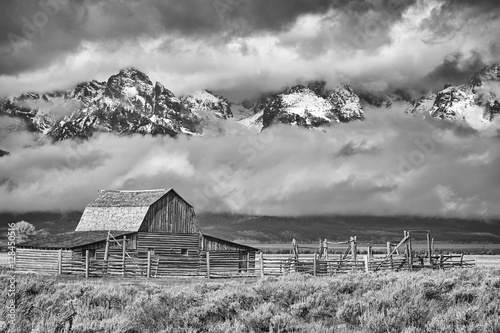 Black and white Teton mountain range with Moulton Barn in the Grand Teton National Park, Wyoming, USA.