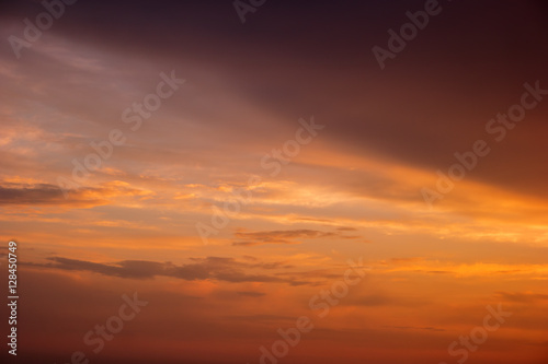 Sky during sunrise. Orange sky and thin clouds. Mother nature wakes up. Admire the magic colors. © DenisProduction.com