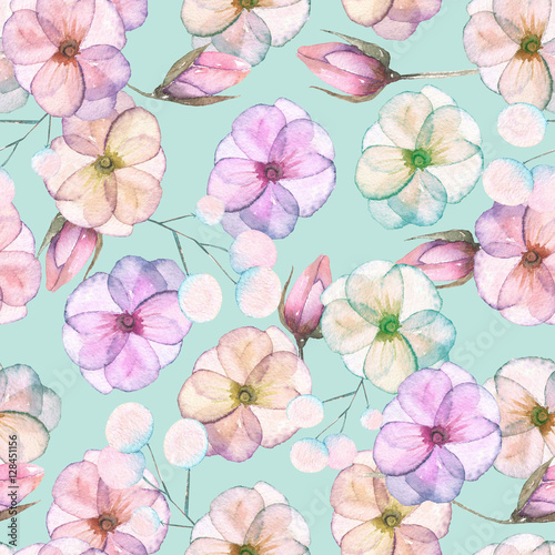 Seamless pattern with watercolor tender flowers in pink and purple pastel shades, hand drawn on a blue background