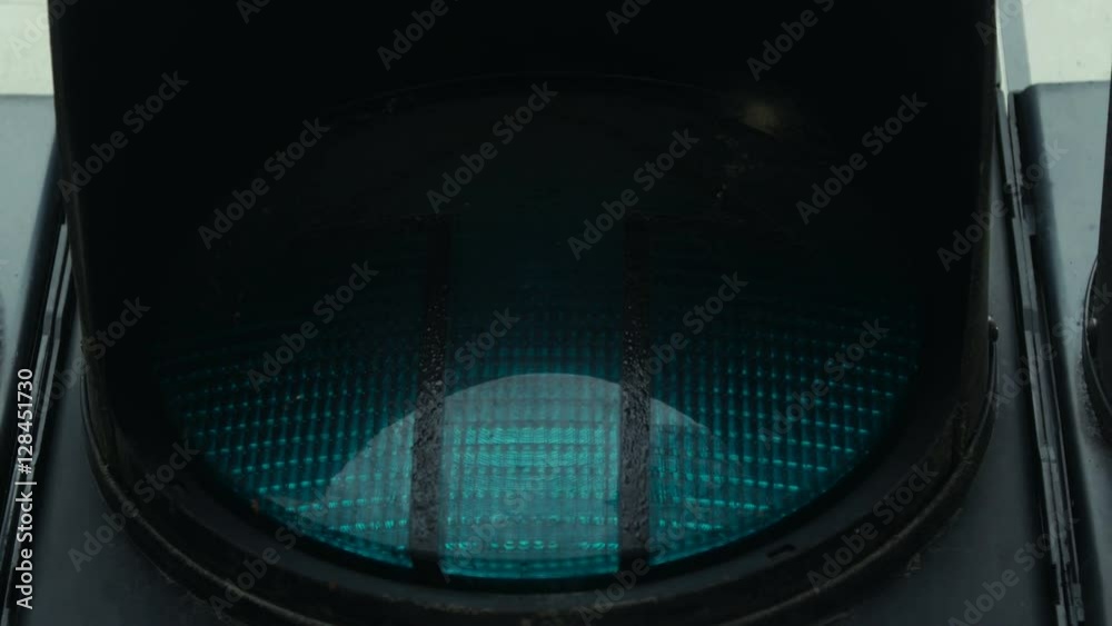 Close up shot of a green traffic light implying you are ready to go straight.