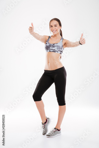 Full length of smiling fitness woman
