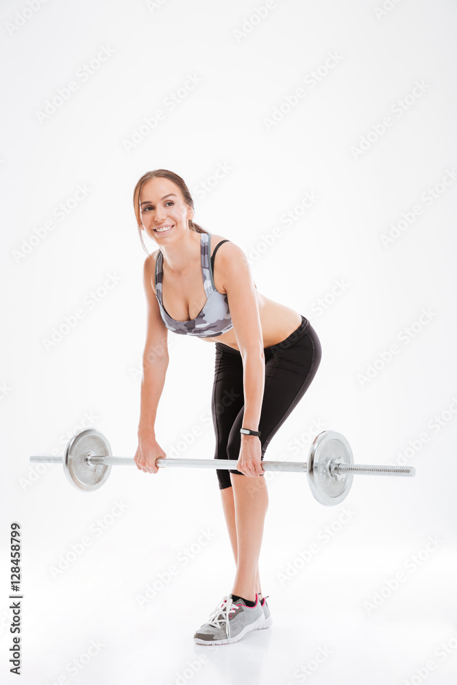 Full length fitness woman with barbell Full length fitness woman with barbell