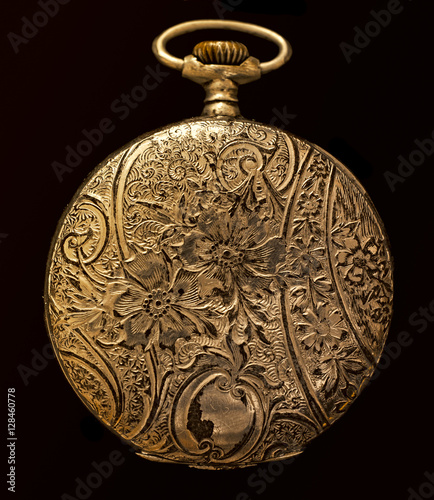Antique silver back cover pocket watch isolated on a pure black