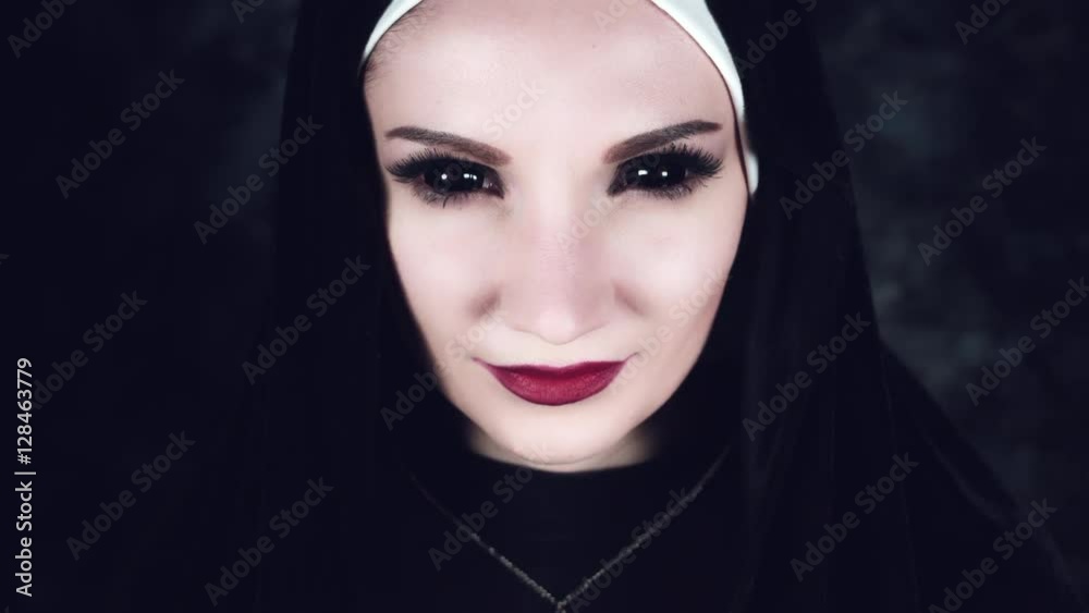4k Halloween Shot of a Horror Nun Smiling with blackout Eyes 4k Halloween Shot of a Horror Nun Smiling with blackout Eyes