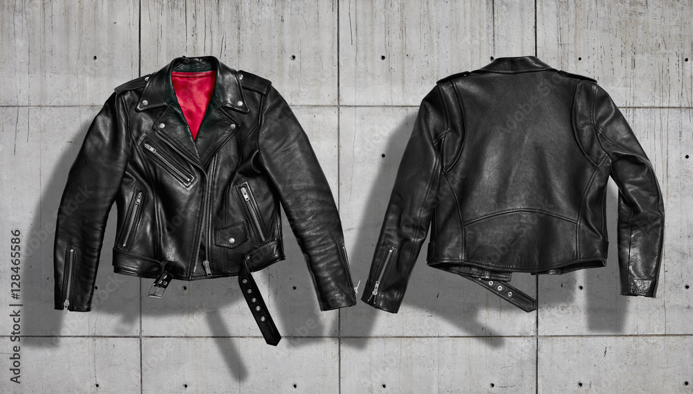 Classic women black leather bikers' jacket with silk red lining shot from  the front and the back isolated on neutral indastrial concrete gray  background Stock Photo | Adobe Stock