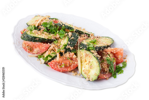 Fresh tomato salad with walnuts and cucumbers.