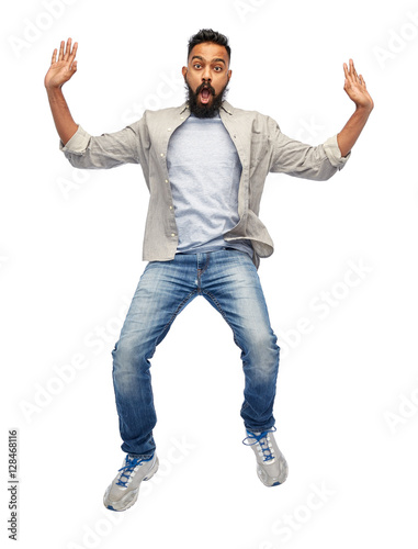 indian young man jumping in air