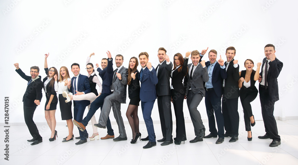 Obraz premium Smiling business people standing together in line in a modern of